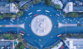 An aerial picture 
    of cars on a roundabout